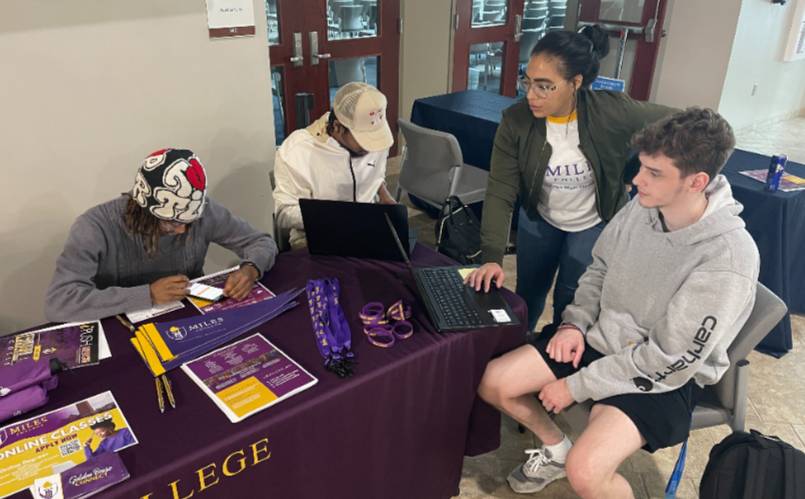 students examine transfer materials from Miles College