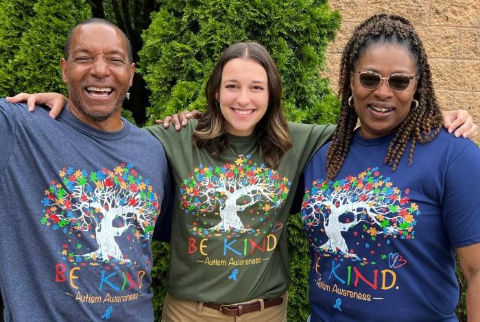 Three Glenwood employees looking into the camera with smiling faces