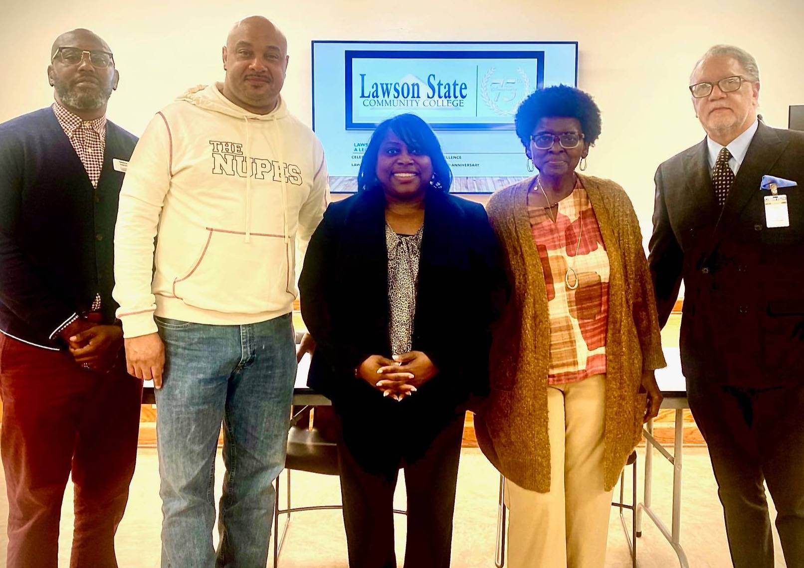 Rep Patrick Sellers in sweatshirt with faculty and staff from Lawson State